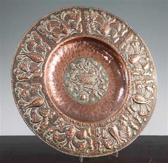 An Arts & Crafts Newlyn circular copper charger, by John Pearson, 15.25in.